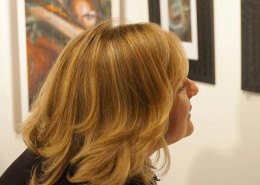 Art exhibition attendee viewing artwork by Tanja Groos